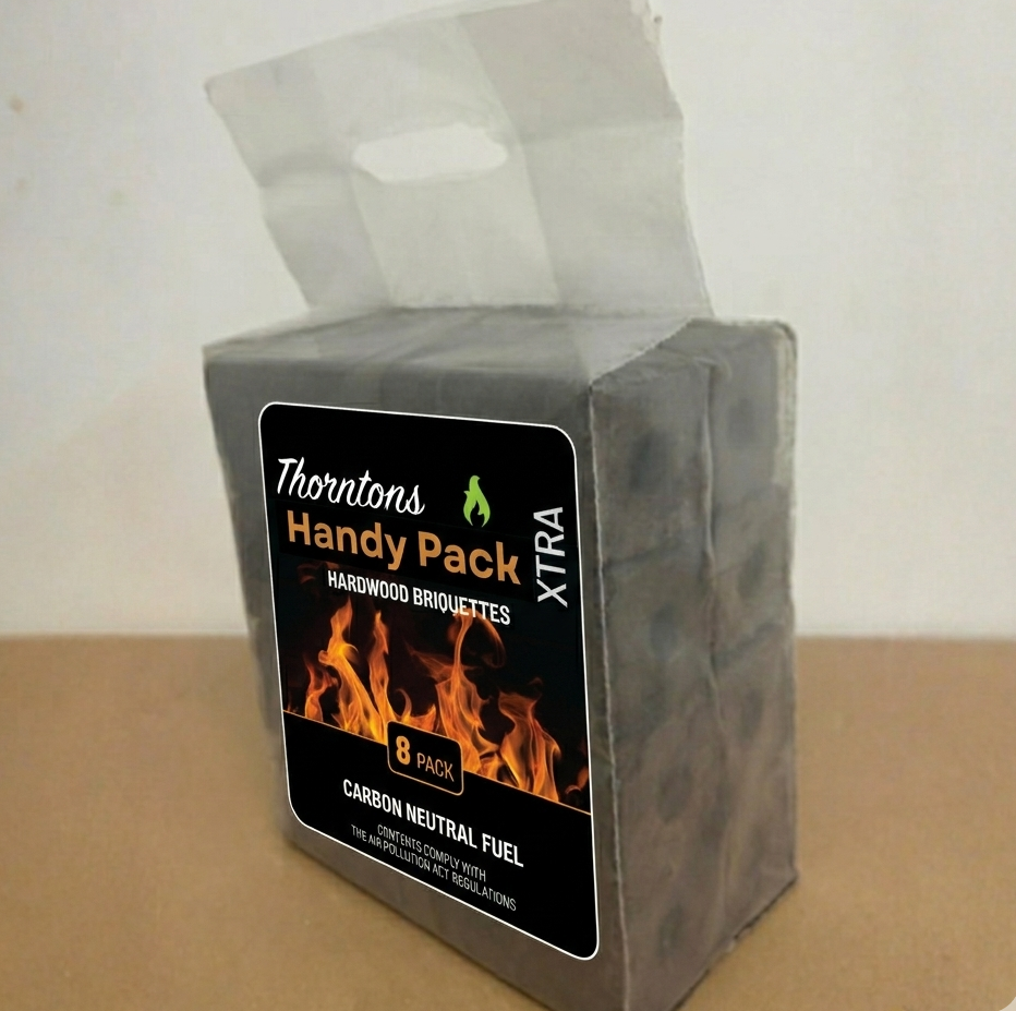 Thorntons Handy Pack XTRA hardwood briquettes packaging on a beige surface with a white background